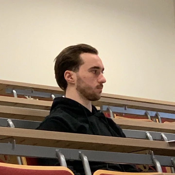 Marti sitting in a lecture hall